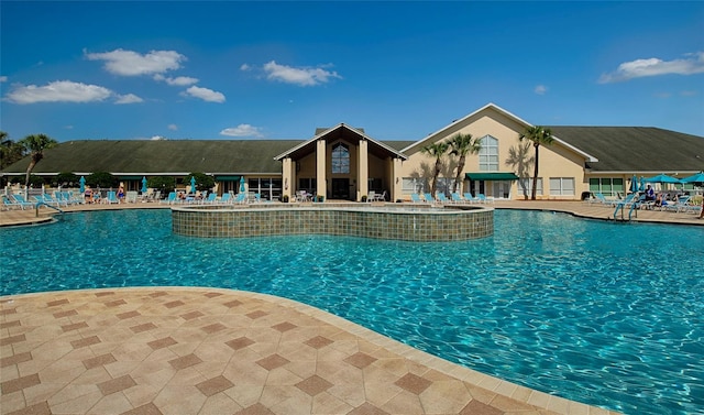 view of swimming pool featuring a patio area