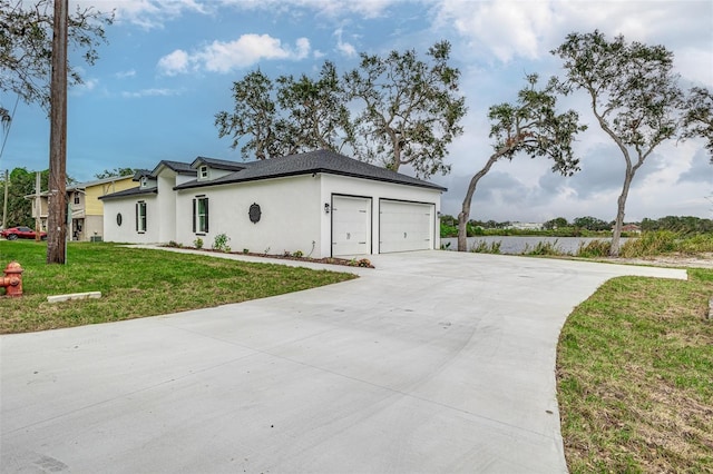 view of home's exterior featuring a yard and a garage