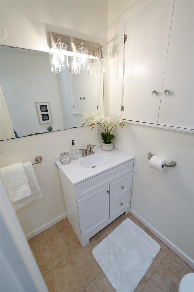 bathroom with tile patterned flooring and vanity