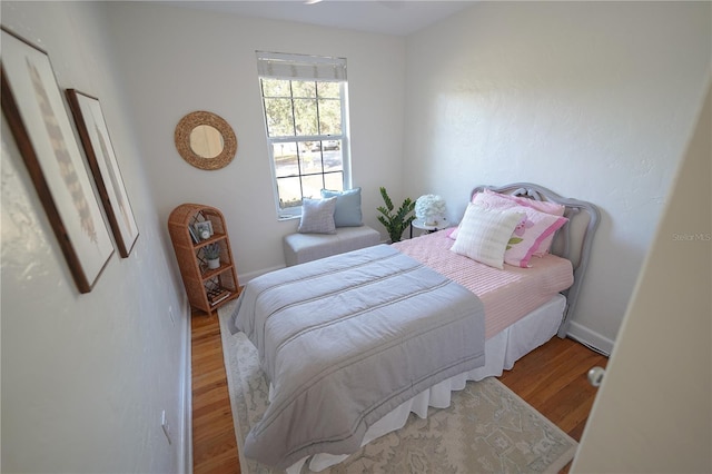 bedroom featuring hardwood / wood-style flooring