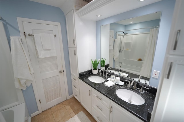 bathroom with tile patterned flooring, shower / tub combination, and vanity