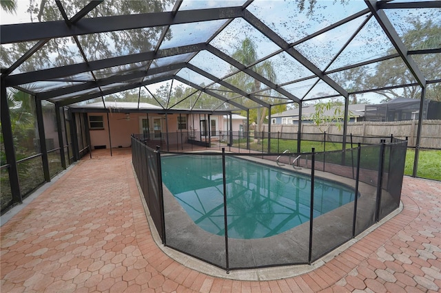 view of pool with a lanai and a patio