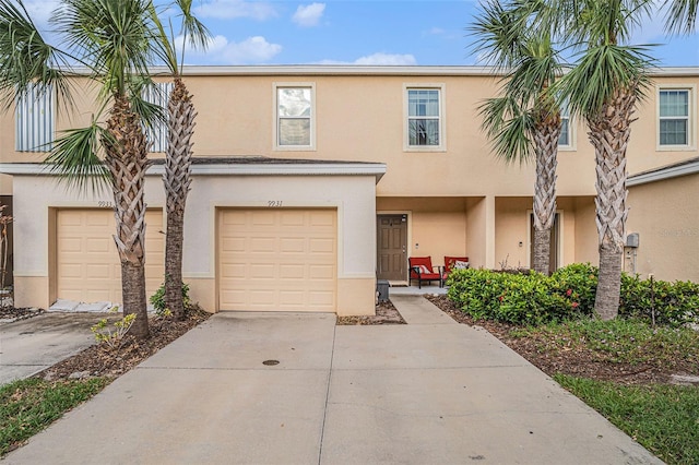 townhome / multi-family property featuring a garage