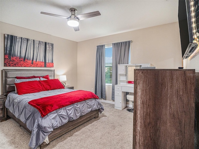 bedroom with ceiling fan and carpet flooring