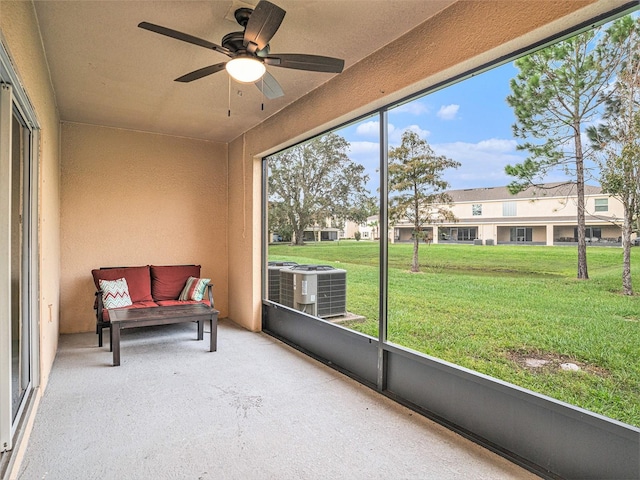 sunroom / solarium with plenty of natural light and ceiling fan