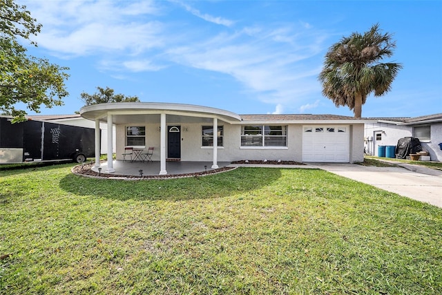 ranch-style home with a front lawn, covered porch, and a garage