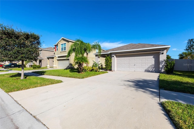 view of front facade featuring a garage and a front lawn