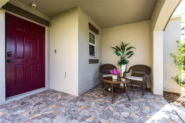 entrance to property featuring a patio area