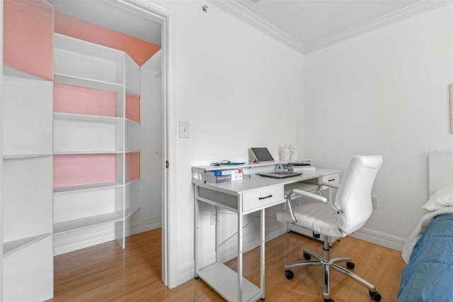 office space featuring ornamental molding and light wood-type flooring