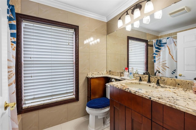 bathroom featuring toilet, a shower with curtain, vanity, crown molding, and tile walls