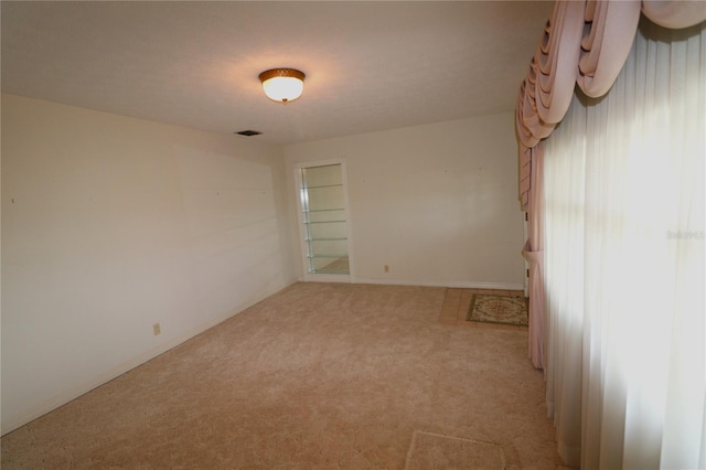 unfurnished room featuring carpet flooring