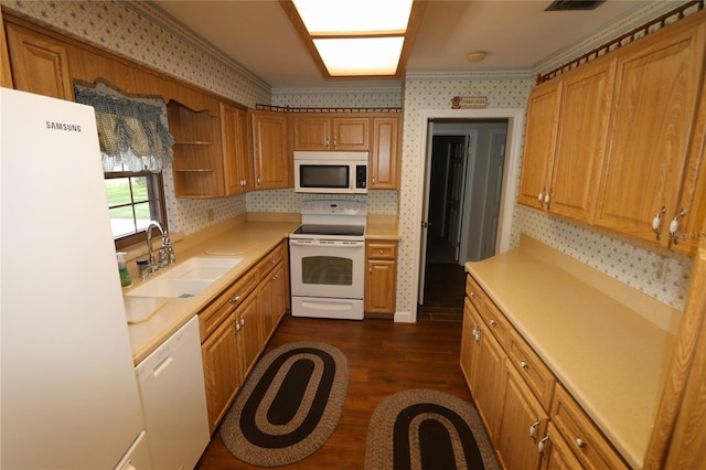 kitchen with dark hardwood / wood-style flooring, crown molding, sink, and white appliances