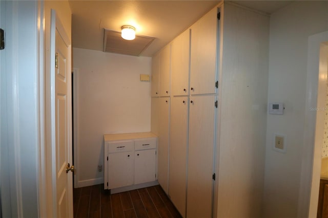 hallway with dark wood-type flooring