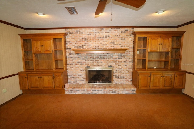 unfurnished living room with a textured ceiling, light carpet, a fireplace, and ceiling fan