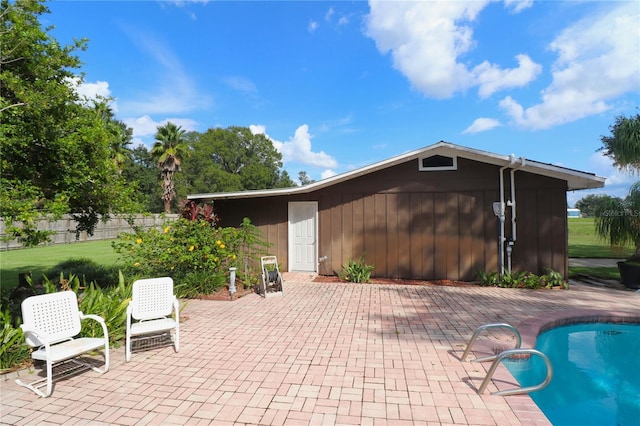 exterior space featuring fence and an outdoor pool