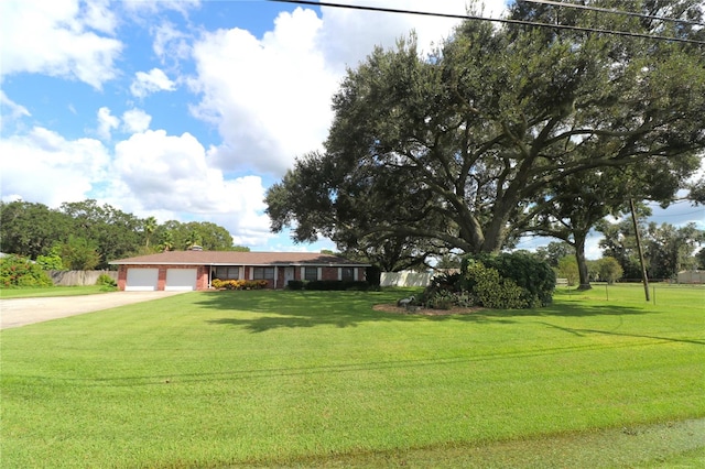 single story home with a front lawn and a garage