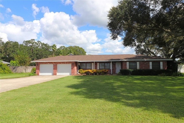 single story home with a front yard and a garage