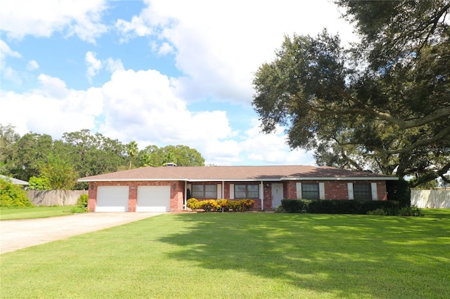 single story home with concrete driveway, a front lawn, fence, and a garage