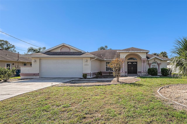 view of front of house featuring a garage and a front lawn