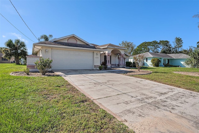 ranch-style house featuring a front yard and a garage