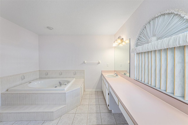 bathroom featuring vanity, tiled bath, a textured ceiling, and tile patterned floors