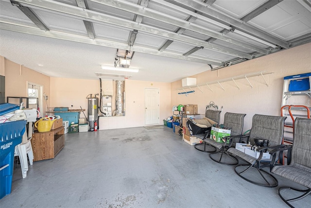 garage featuring water heater and a garage door opener