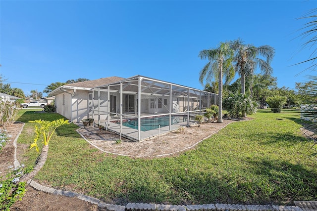 view of pool featuring a lanai and a yard