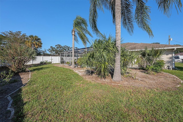 view of yard with a lanai