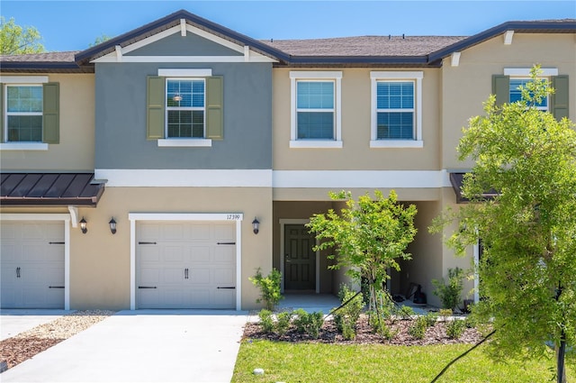 townhome / multi-family property featuring a garage