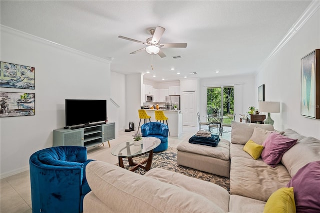 living room with light tile patterned floors, ceiling fan, and crown molding