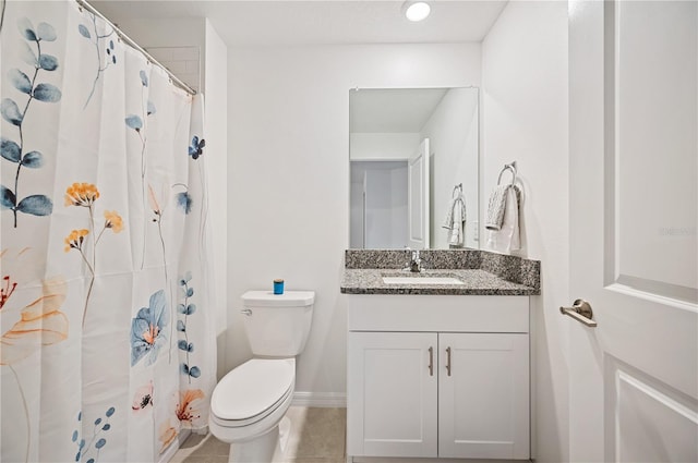 bathroom featuring vanity, a shower with shower curtain, tile patterned floors, and toilet