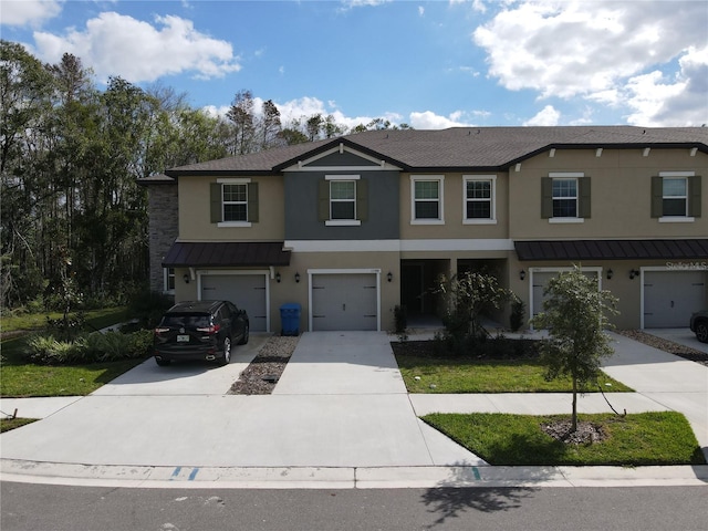 view of front of property with a garage