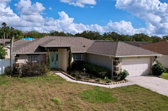 ranch-style house with a garage and a front lawn