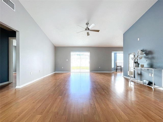 unfurnished living room featuring a textured ceiling, light hardwood / wood-style floors, and ceiling fan