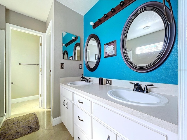 bathroom with tile patterned flooring and vanity