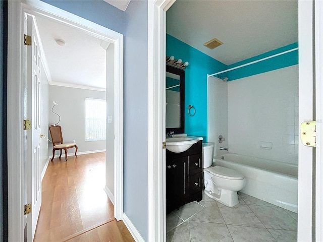 full bathroom featuring shower / bath combination, vanity, crown molding, hardwood / wood-style floors, and toilet