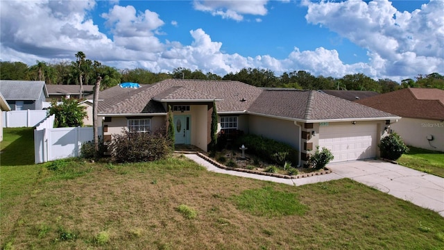 ranch-style home featuring a garage and a front yard