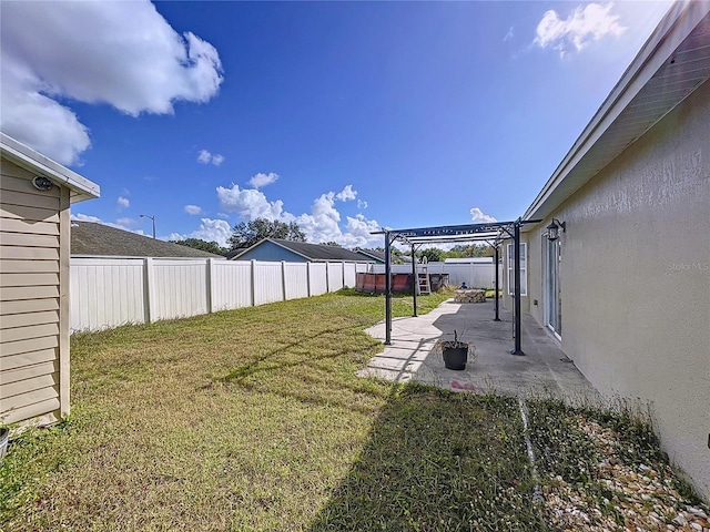 view of yard featuring a pergola and a patio