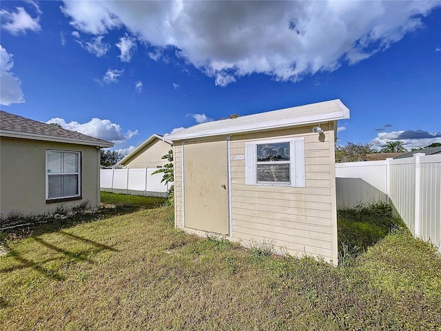 view of outdoor structure with a yard