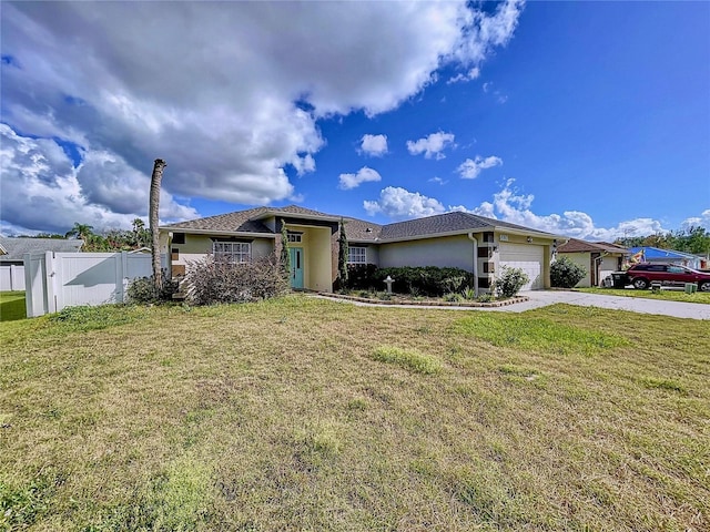 view of front of home featuring a front yard and a garage