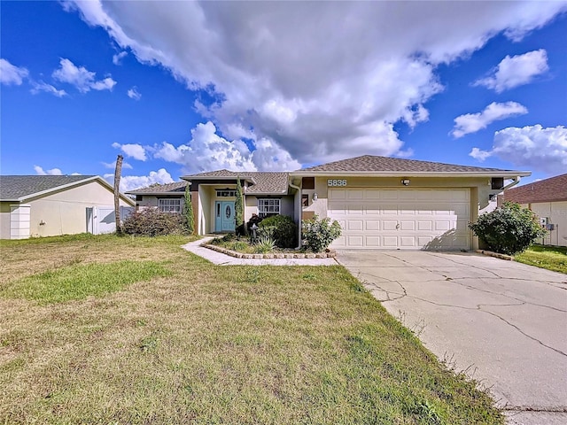 view of front facade featuring a front yard and a garage