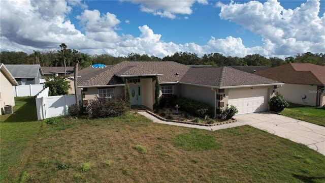 single story home with a front yard, a garage, and central air condition unit