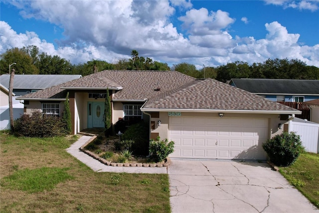 ranch-style house with a front yard and a garage