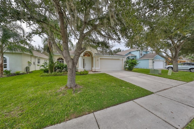 single story home featuring a front yard and a garage