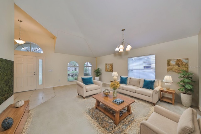 living room with an inviting chandelier, light tile patterned flooring, and lofted ceiling