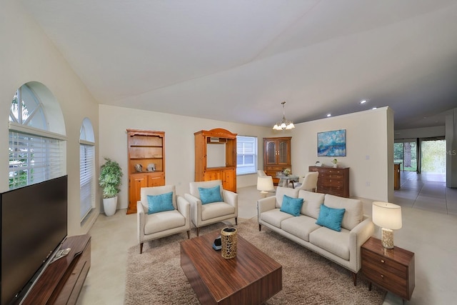 carpeted living room featuring a notable chandelier