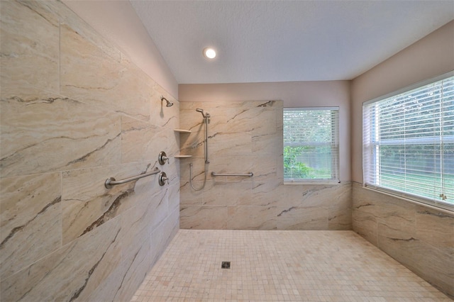 bathroom with a tile shower