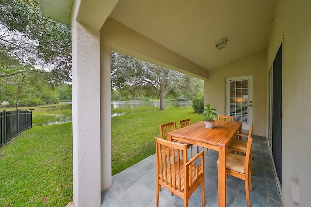 view of patio / terrace featuring a water view