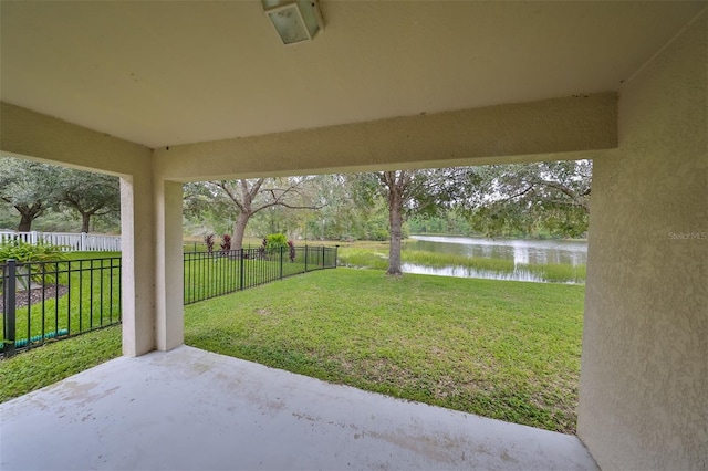 view of yard featuring a patio area and a water view