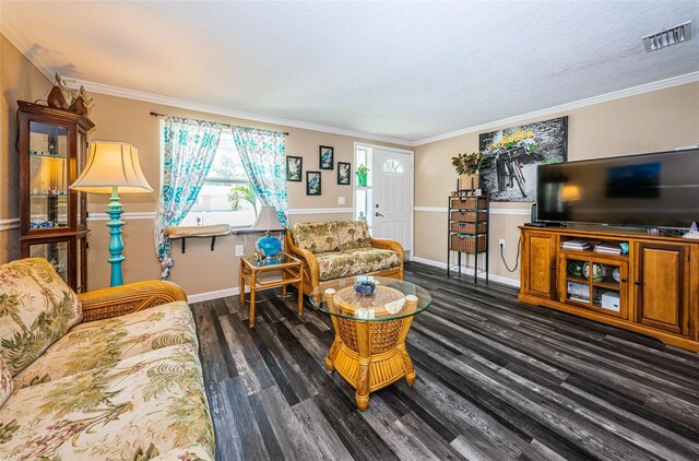 living room with crown molding and dark wood-type flooring